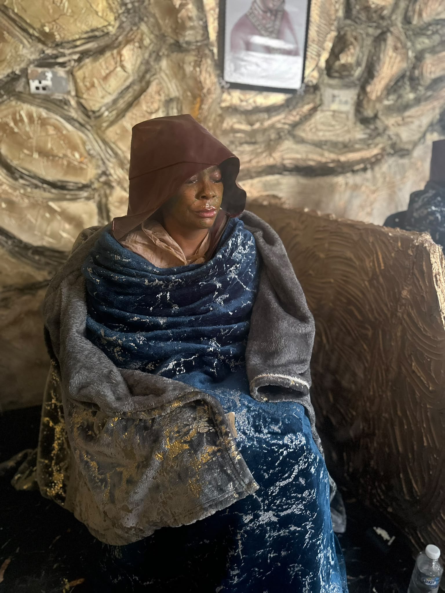 A guest wrapped in blankets during a traditional Weyba steam treatment at LAZA